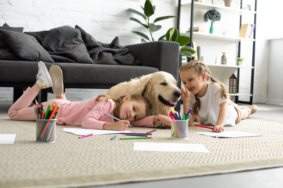 canva-smiling-kids-lying-on-floor-together-with-golden-retriever-dog-at-home-1_orig